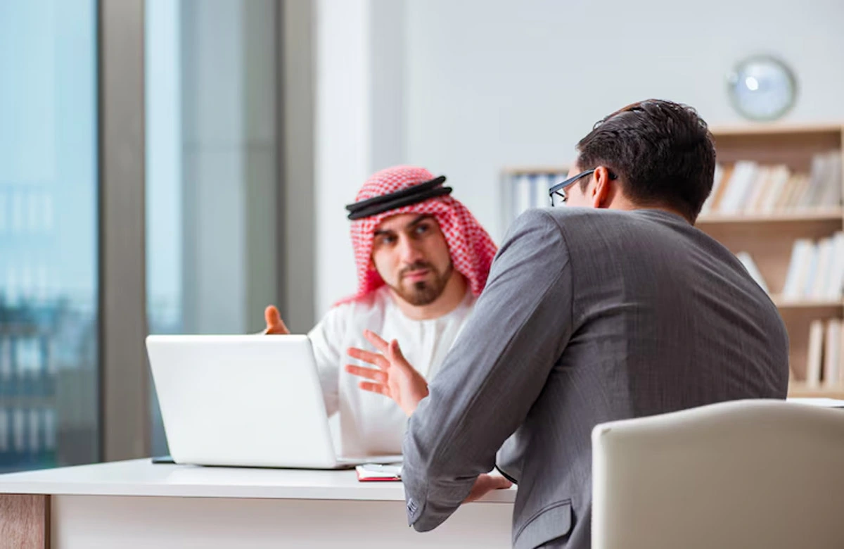 Business professionals having a discussion in a modern office for UAE Businesses
