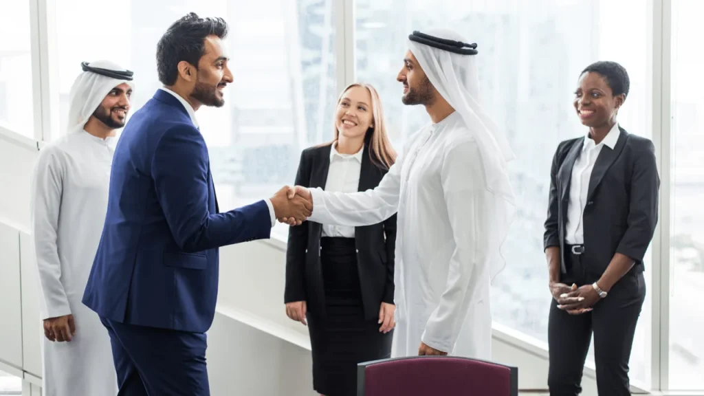 Business professionals discussing strategy on tablet with skyscrapers in background.