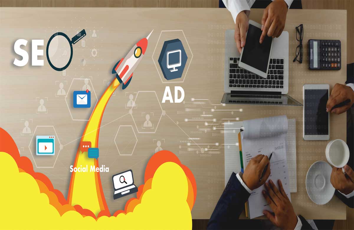 Team at a desk planning SEO and digital strategy with visuals of social media, email, and ads—representing crafted marketing ads in Dubai.