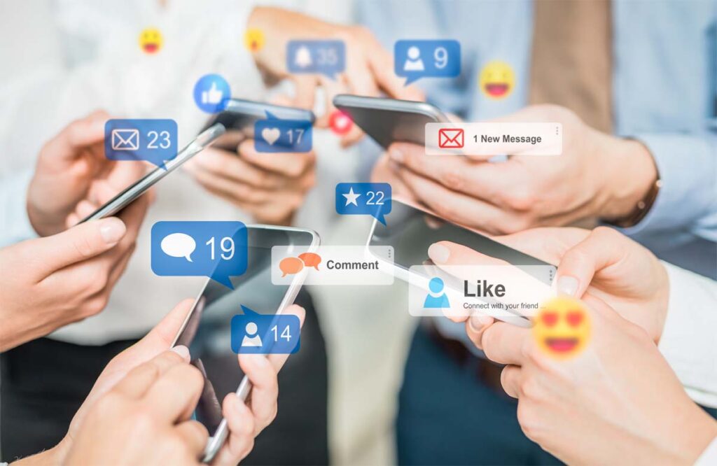 People using smartphones with floating social media icons, symbolizing engagement and SEO Optimization Strategies for Dubai through social platforms.