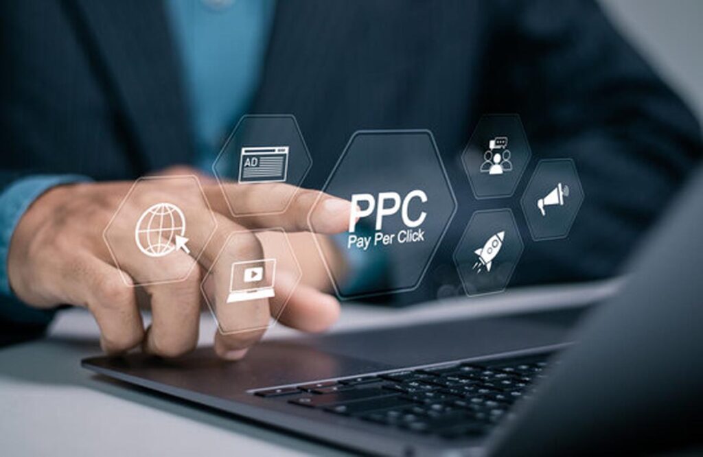 Businessman managing PPC account management in Dubai through digital interface on laptop.